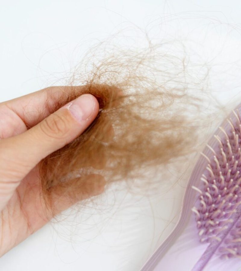 bunch-of-hair-in-the-hand-of-a-young-woman-after-c-2023-11-27-05-05-48-utc
